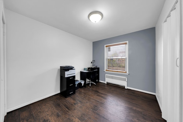 office area featuring dark hardwood / wood-style floors and radiator