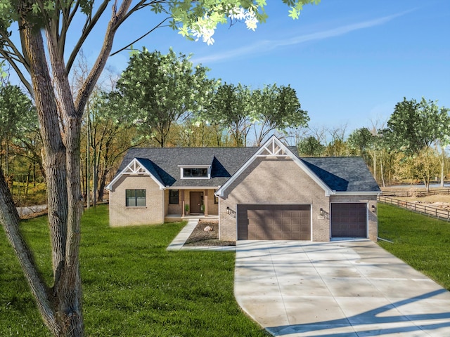 view of front of house featuring a front lawn and a garage