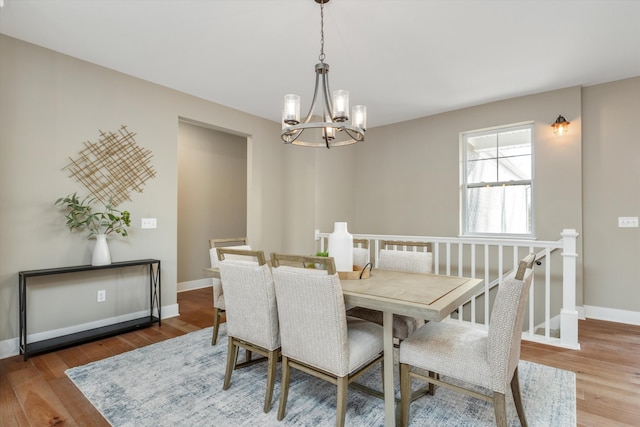 dining room featuring a chandelier and hardwood / wood-style floors