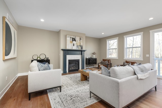 living room featuring plenty of natural light and light wood-type flooring