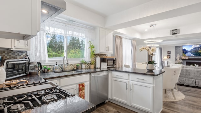 kitchen featuring dark wood-type flooring, white cabinetry, sink, and stainless steel appliances