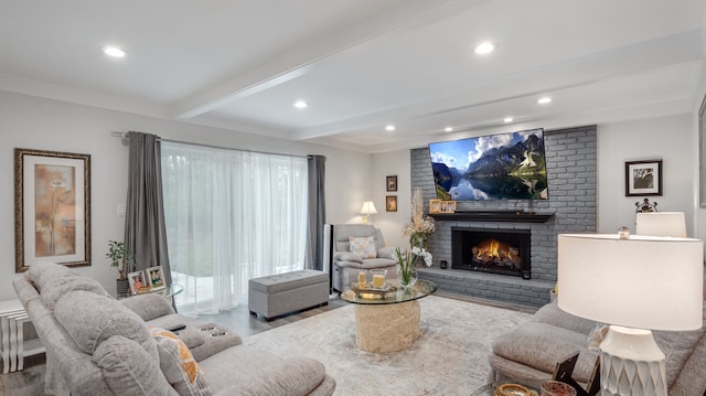 living room featuring beamed ceiling and a fireplace