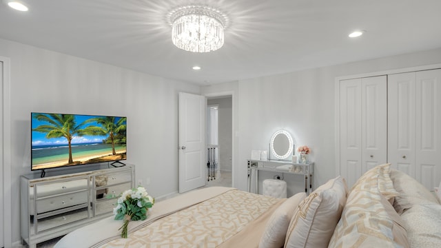 bedroom featuring a closet and a notable chandelier