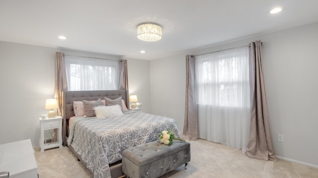 bedroom with light colored carpet