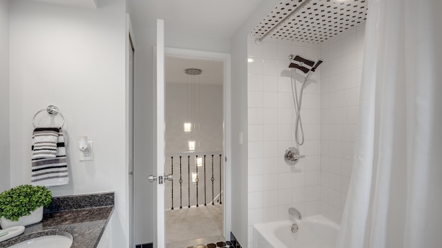 bathroom featuring vanity and shower / bath combo with shower curtain