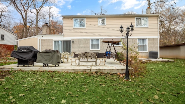 back of house with a yard, a patio, and cooling unit