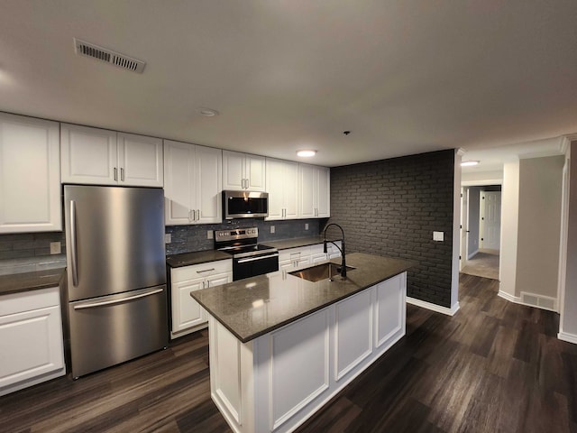 kitchen with stainless steel appliances, white cabinetry, dark hardwood / wood-style floors, and sink