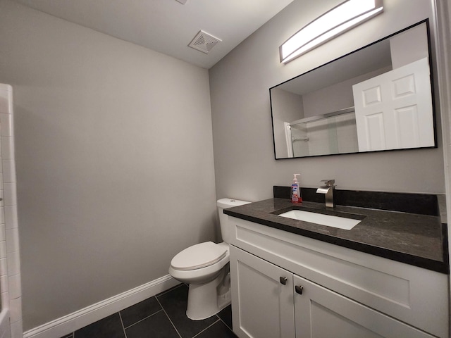 bathroom featuring tile patterned floors, a shower, vanity, and toilet