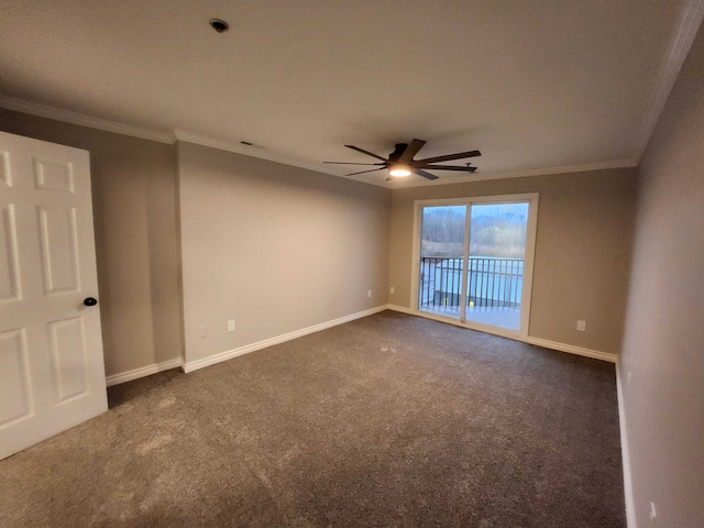 carpeted empty room with ceiling fan and crown molding