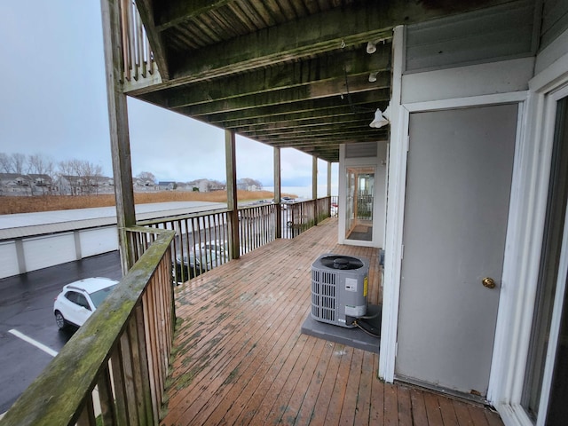 wooden deck featuring central air condition unit