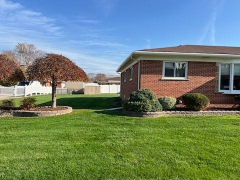 view of home's exterior featuring a lawn