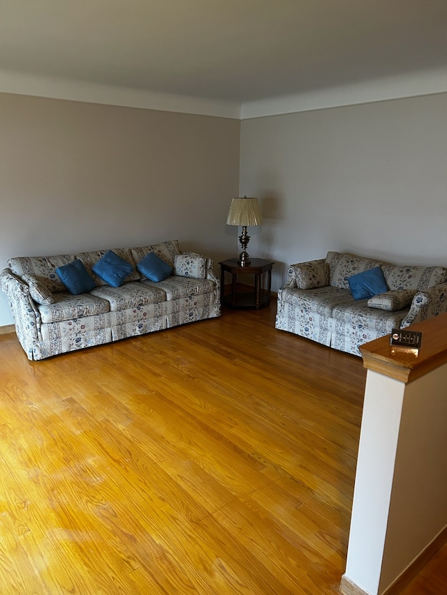 unfurnished living room with hardwood / wood-style floors