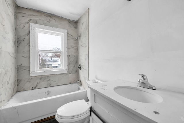 full bathroom featuring vanity, toilet, and tiled shower / bath