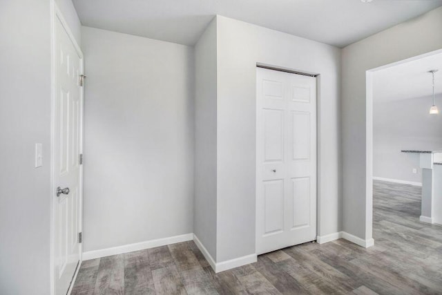 unfurnished bedroom featuring hardwood / wood-style flooring and a closet