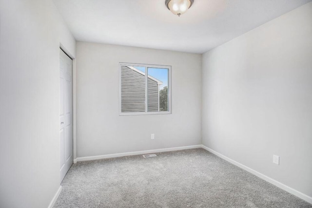 empty room featuring carpet flooring