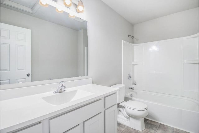 full bathroom featuring shower / bathing tub combination, hardwood / wood-style floors, vanity, and toilet