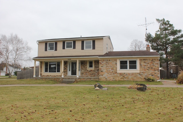 front facade with central AC and a front lawn