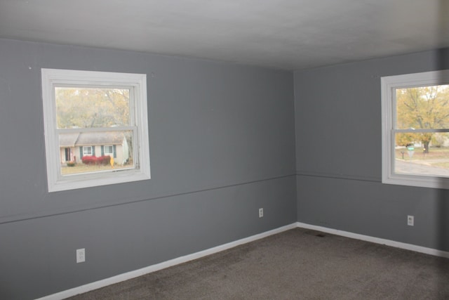 unfurnished room featuring carpet flooring