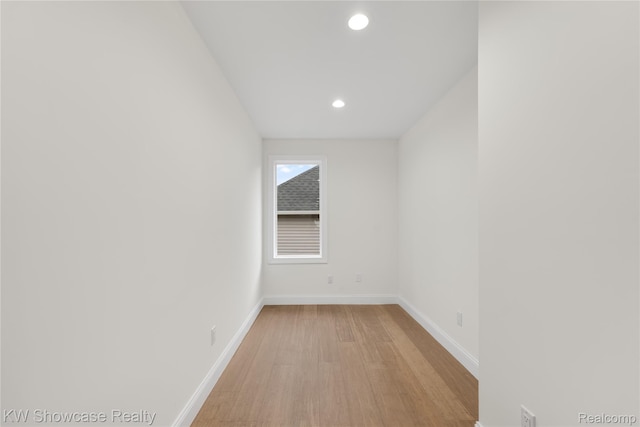 5245 Buell Dr, Commerce Twp, MI 48382 - unfurnished room featuring light wood-style flooring, recessed lighting, and baseboards