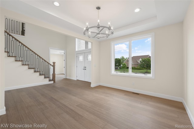 5245 Buell Dr, Commerce Twp, MI 48382 - entryway featuring a chandelier, stairs, wood finished floors, baseboards, and recessed lighting