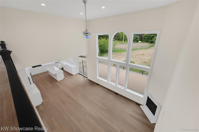 5245 Buell Dr, Commerce Twp, MI 48382 - unfurnished living room with ceiling fan, light wood-style floors, recessed lighting, and a fireplace