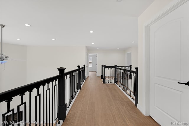 5245 Buell Dr, Commerce Twp, MI 48382 - corridor featuring recessed lighting, an upstairs landing, and baseboards