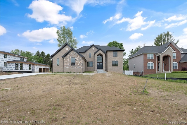 5245 Buell Dr, Commerce Twp, MI 48382 - french country inspired facade featuring brick siding