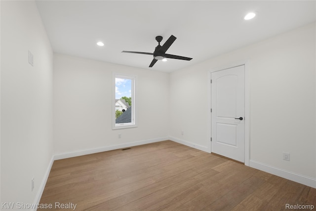 5245 Buell Dr, Commerce Twp, MI 48382 - unfurnished room with a ceiling fan, wood finished floors, recessed lighting, and baseboards