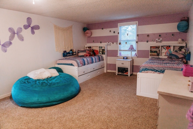 bedroom with a textured ceiling and carpet flooring