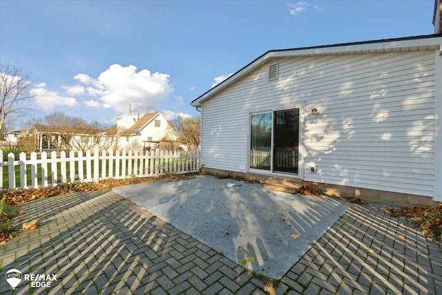 wooden deck with a patio area