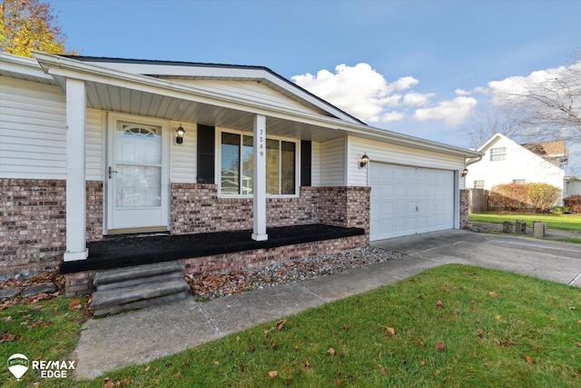 ranch-style home with covered porch and a garage