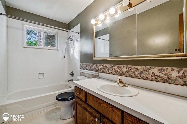 full bathroom with shower / tub combination, vanity, and toilet