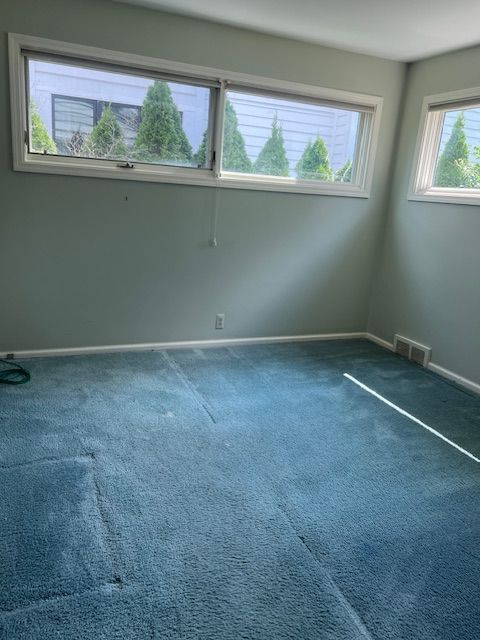 empty room with dark carpet