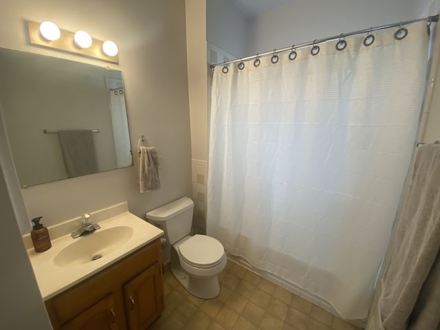 bathroom with toilet and vanity