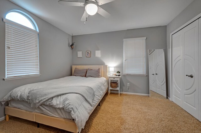 carpeted bedroom featuring ceiling fan