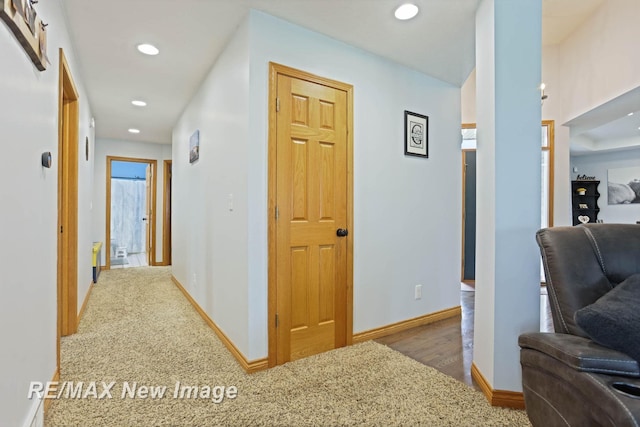 hall with wood-type flooring