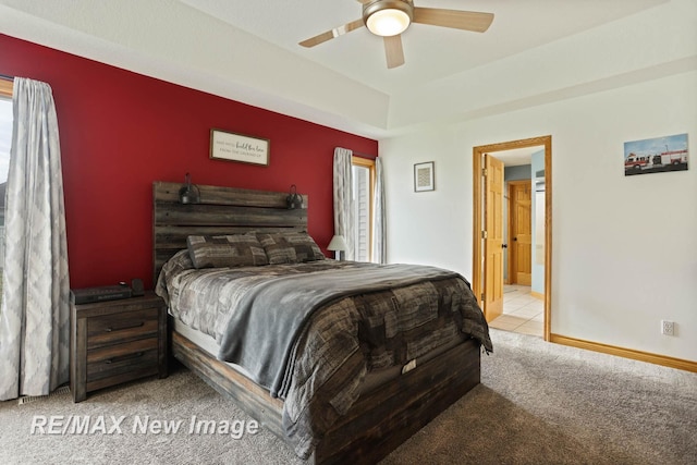 carpeted bedroom with connected bathroom and ceiling fan