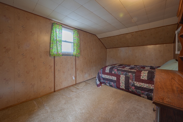 carpeted bedroom featuring vaulted ceiling