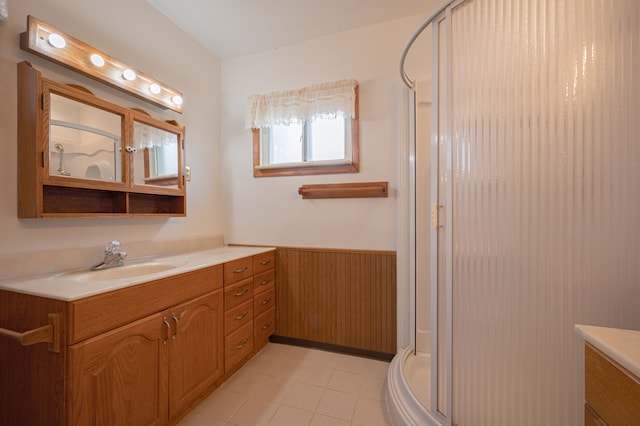 bathroom with vanity, tile patterned floors, and a shower with shower door