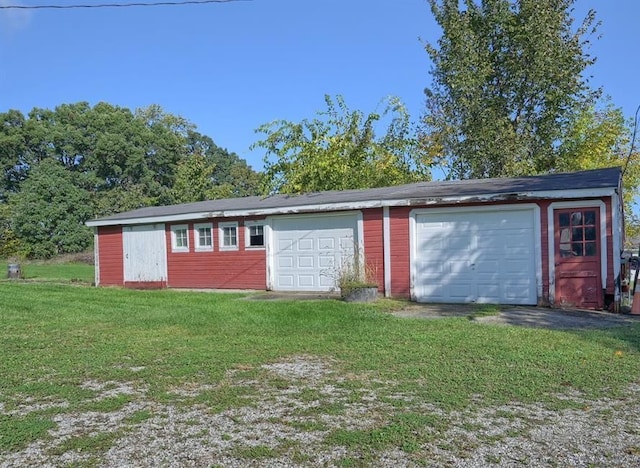 garage with a lawn