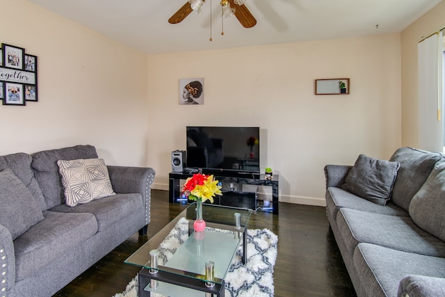 living room with dark hardwood / wood-style floors and ceiling fan