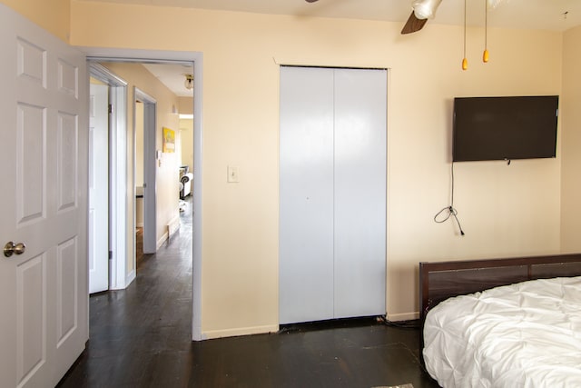 bedroom featuring ceiling fan and dark hardwood / wood-style flooring