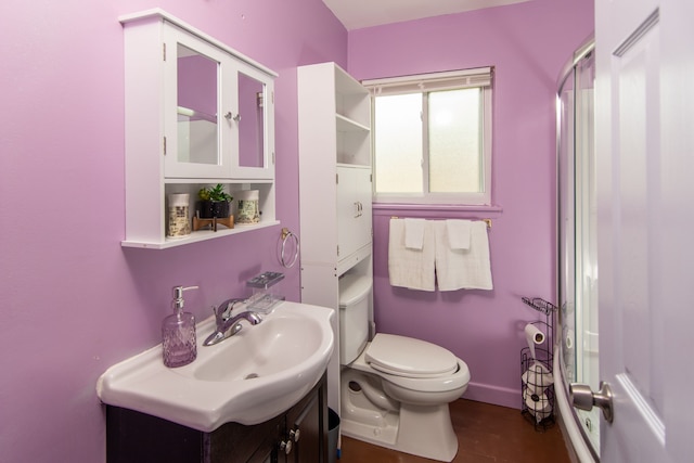 bathroom featuring tile patterned floors, vanity, and toilet