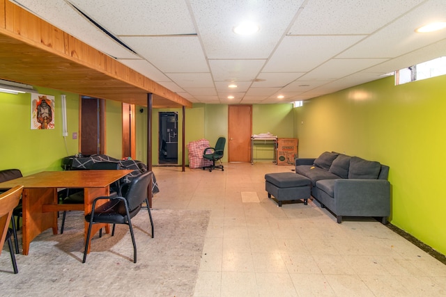 playroom with a paneled ceiling