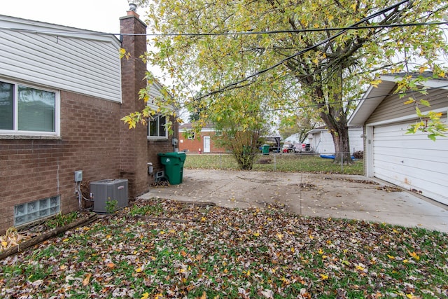 view of yard featuring a patio and central AC