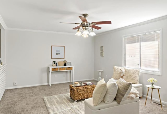 sitting room featuring light carpet, ceiling fan, and ornamental molding