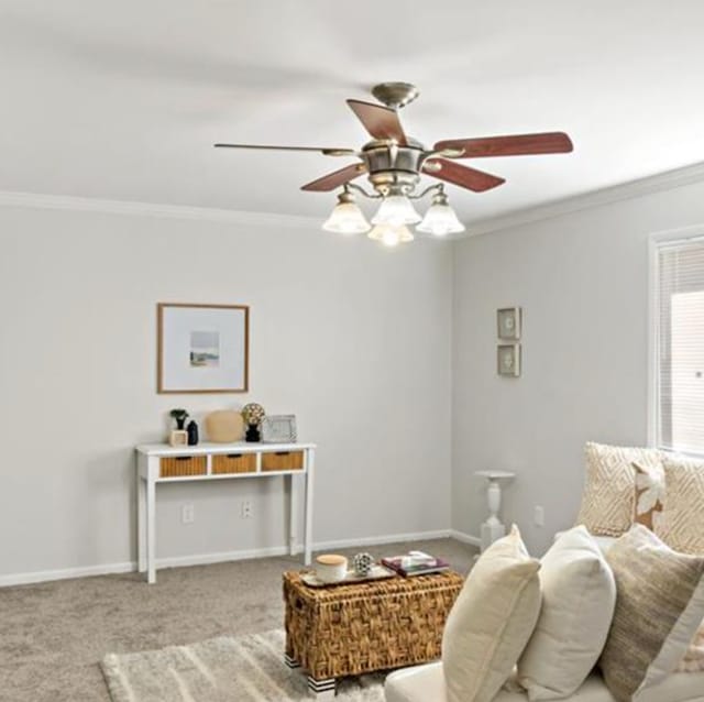 living area with carpet flooring, ceiling fan, and ornamental molding