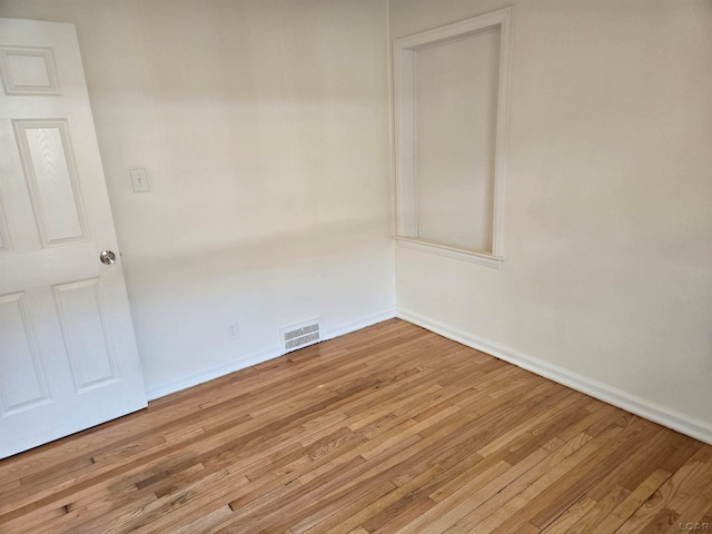 empty room with light wood-type flooring