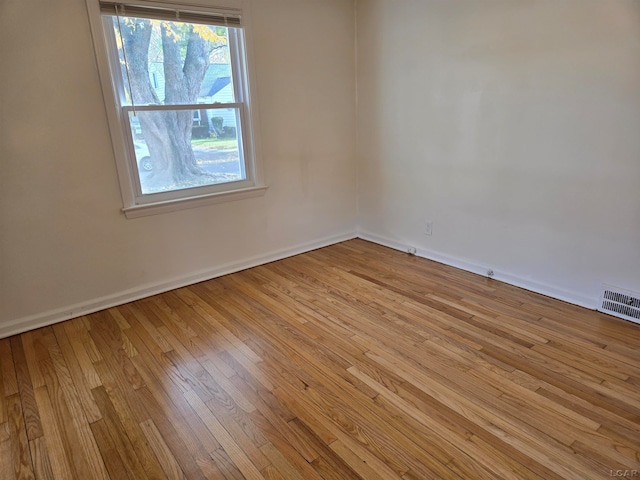 spare room with light wood-type flooring