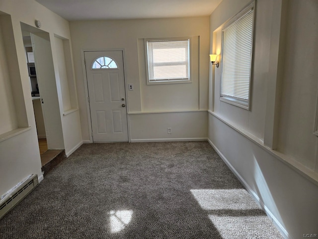 foyer featuring carpet floors and a baseboard heating unit